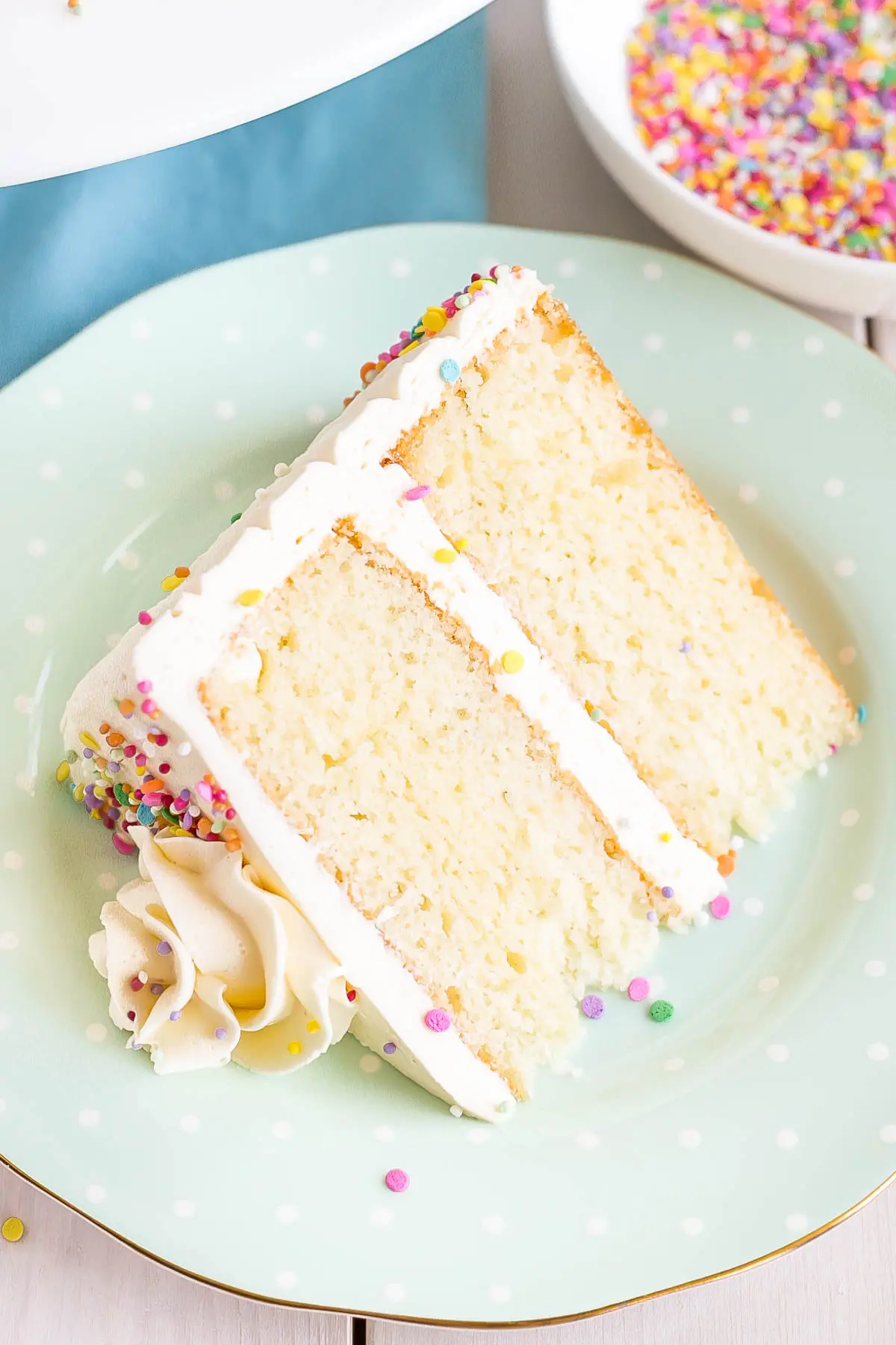 Slice of cake on a plate showing the layers.