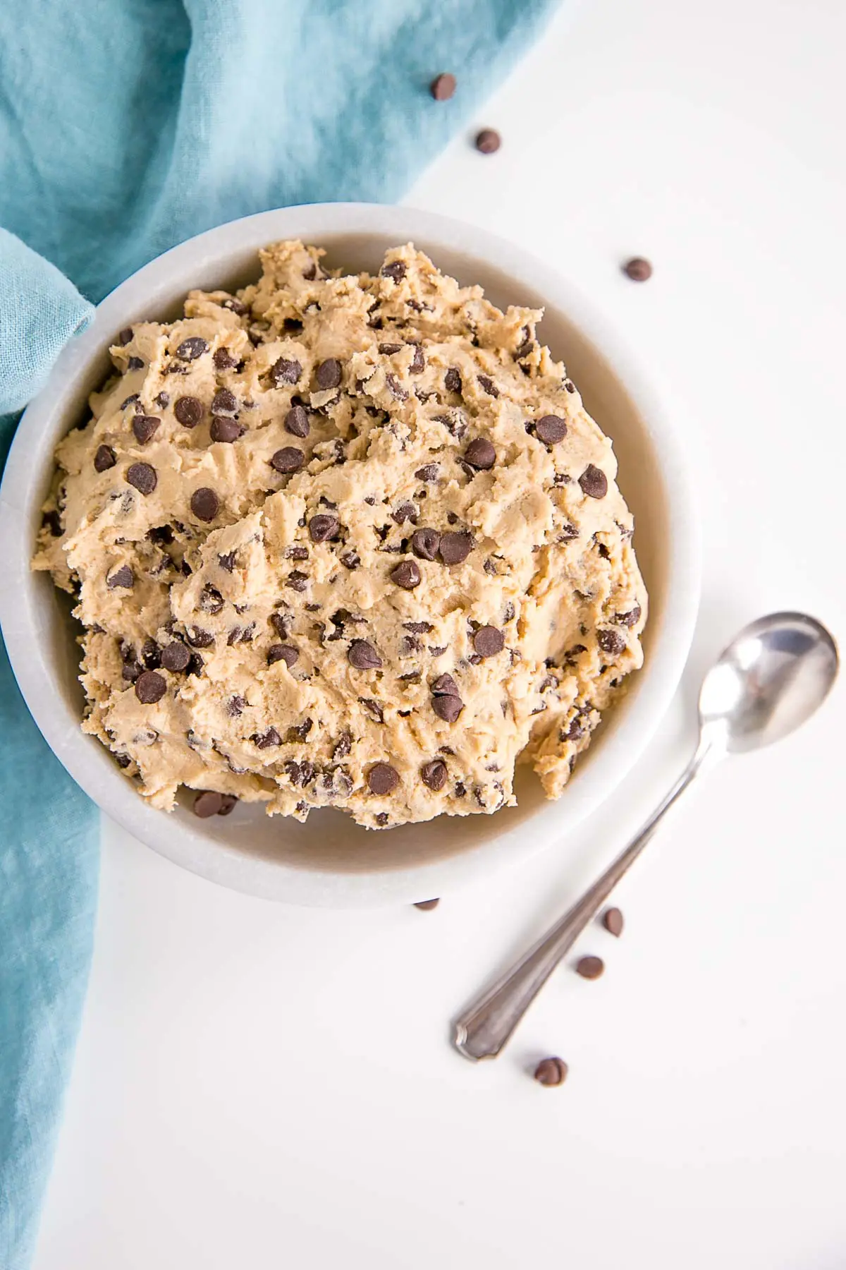 Overhead shot of the cookie dough in a bowl with spoon off to the side.