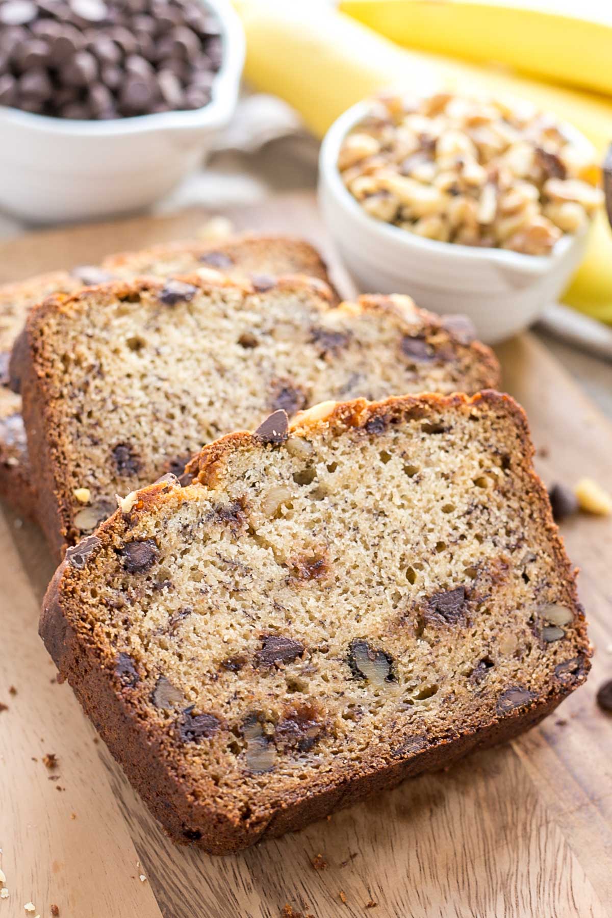 Banana bread slices on a cutting board.