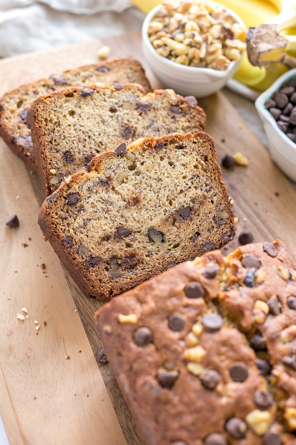 Banana bread slices on a cutting board.