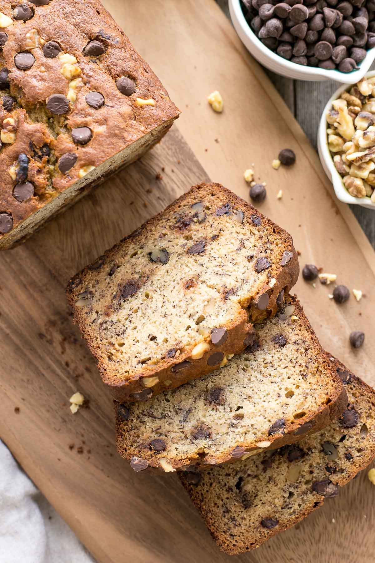 Overhead shot of banana bread slices on a serving board.