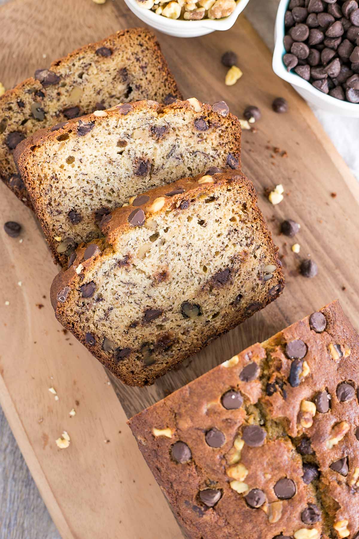 Banana bread sitting on top of a wooden cutting board