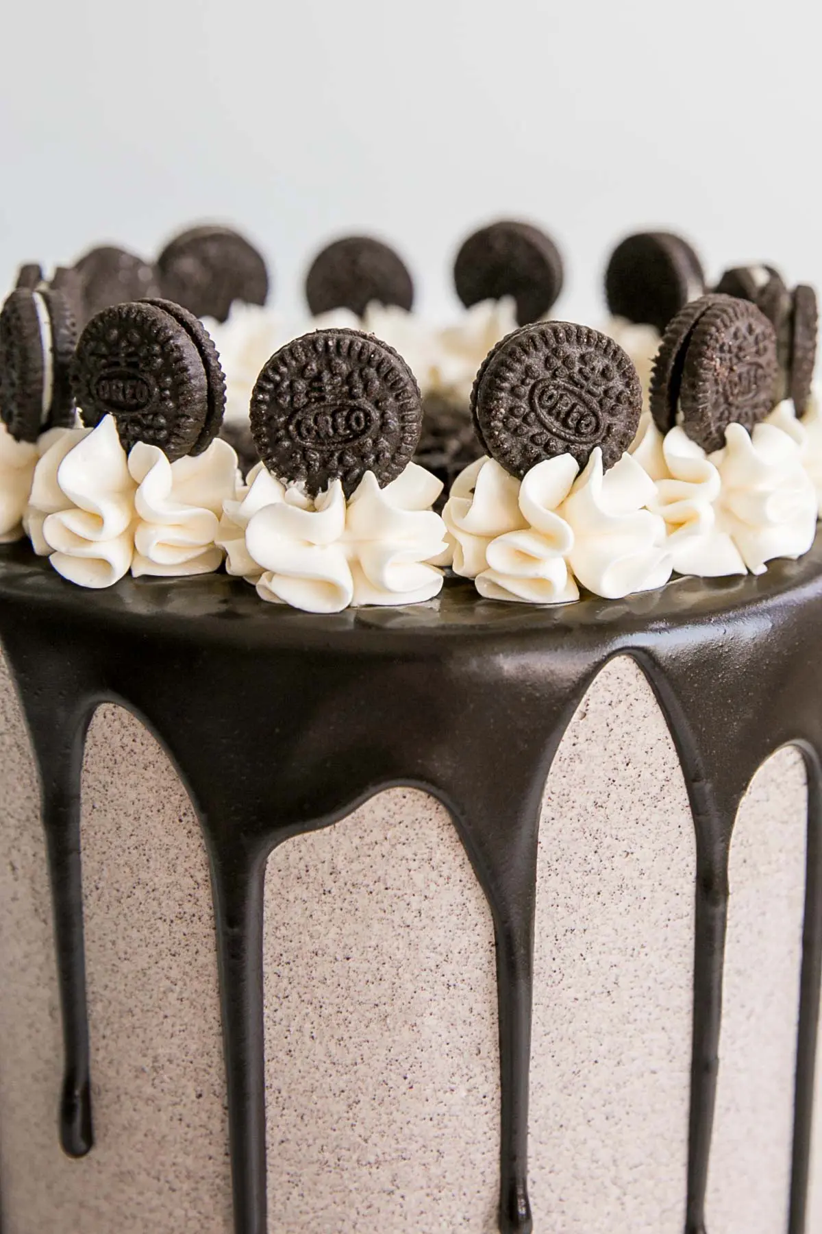 Close up of mini Oreos on top of a Cookies and Cream Cake.