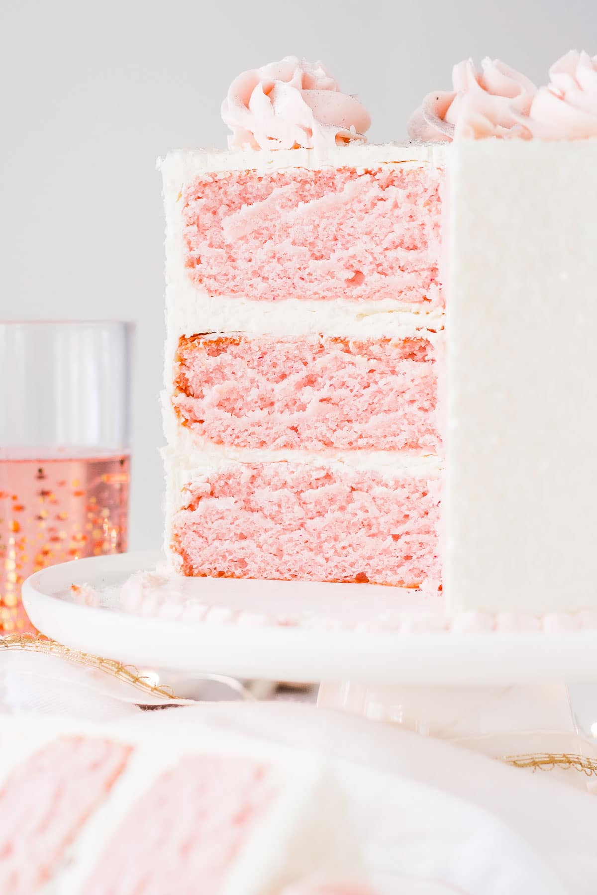 Cross section of pink champagne cake with vanilla buttercream.