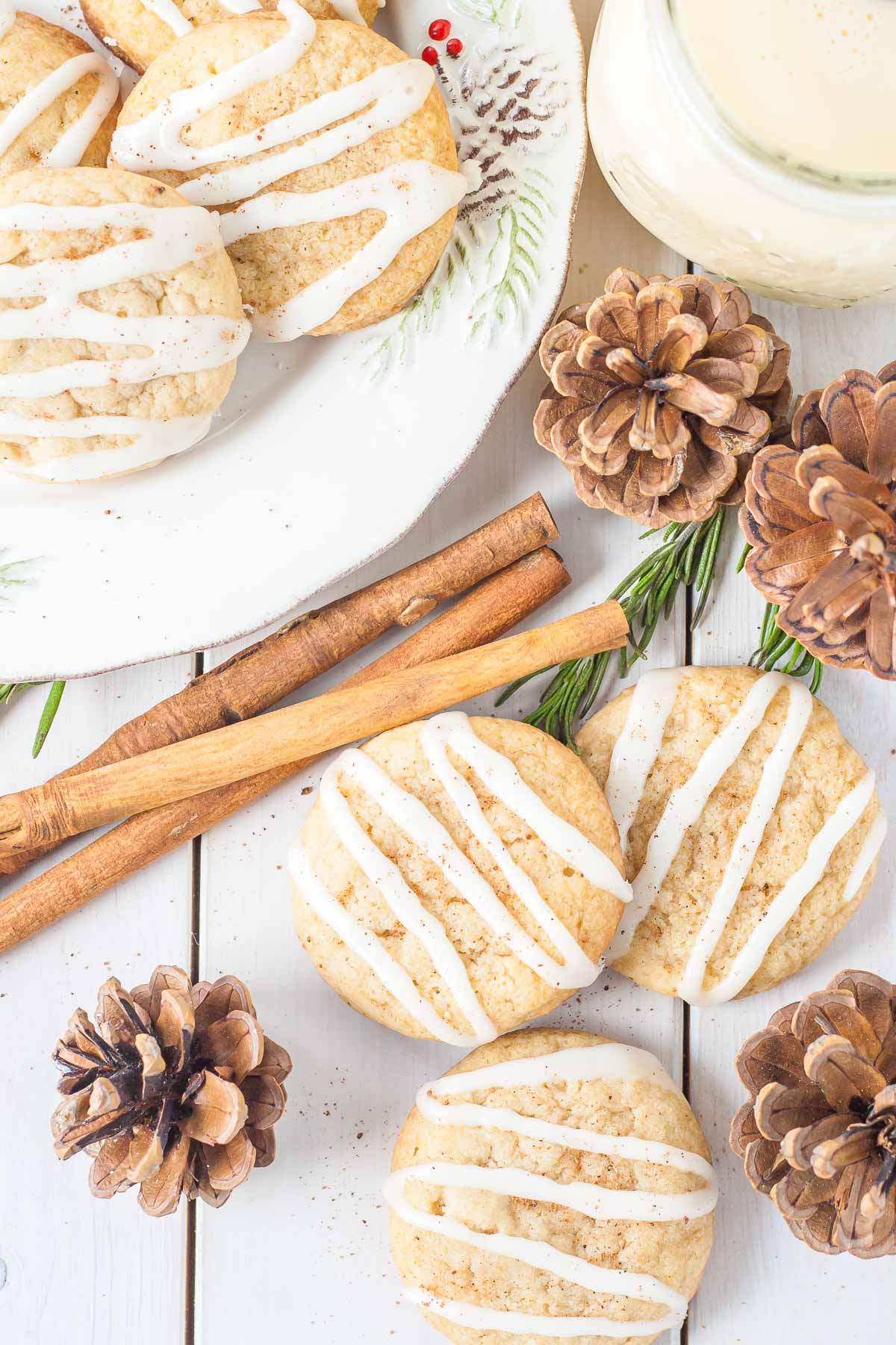 Cookies on a white table with festive decor.