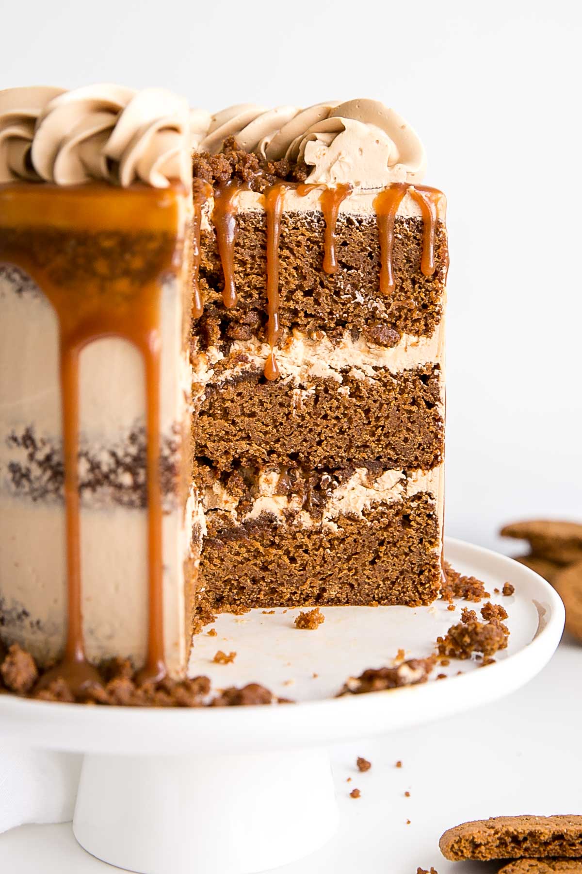 Cross-section of a gingerbread cake with caramel Swiss meringue buttercream.