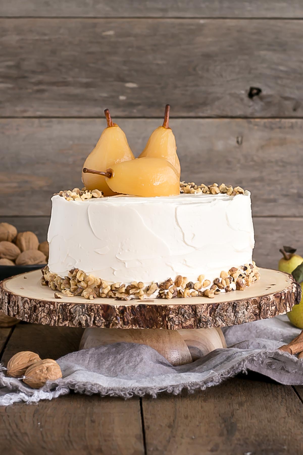 Cake on a wooden cake stand.