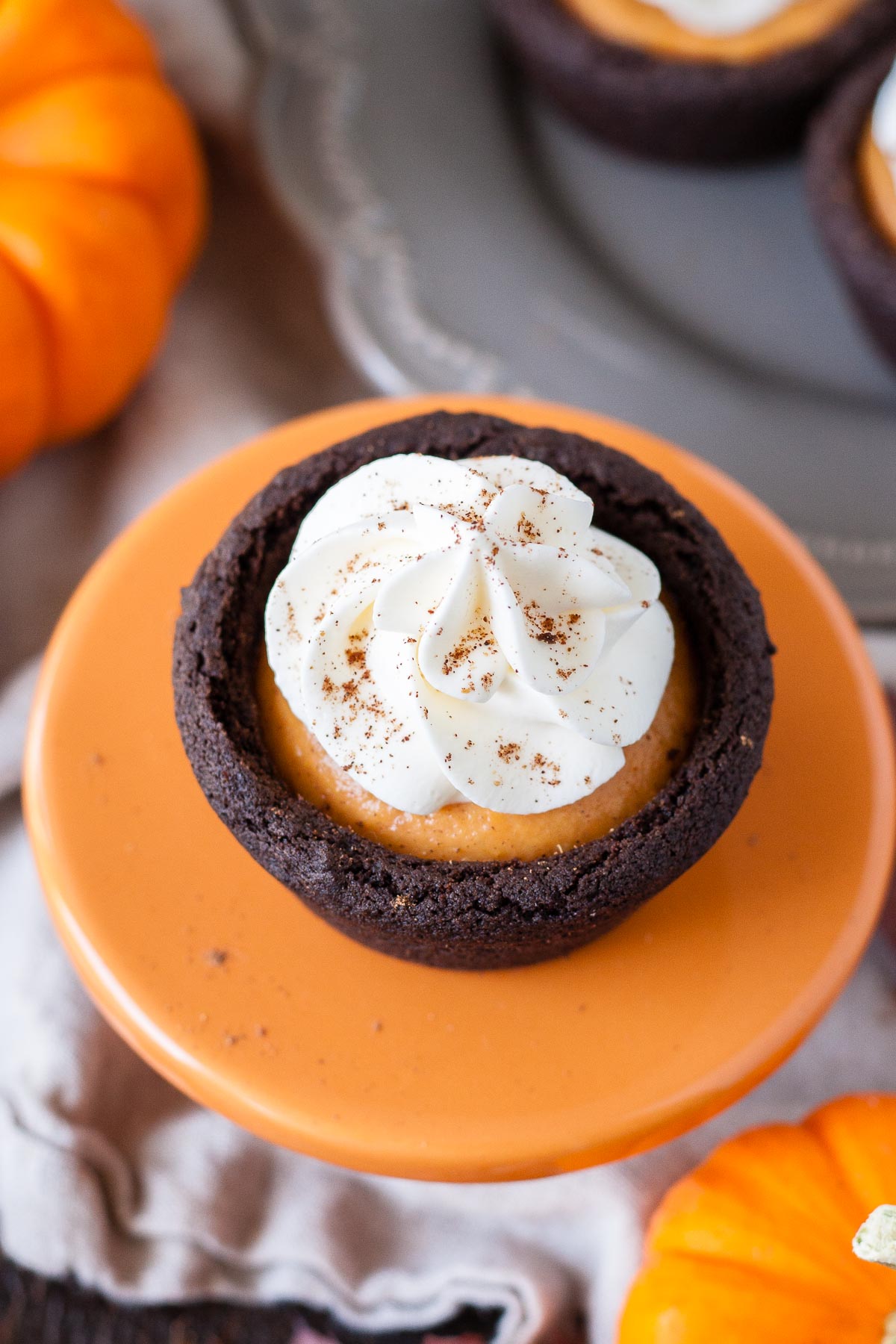 Cookie cup on a small orange cupcake stand.