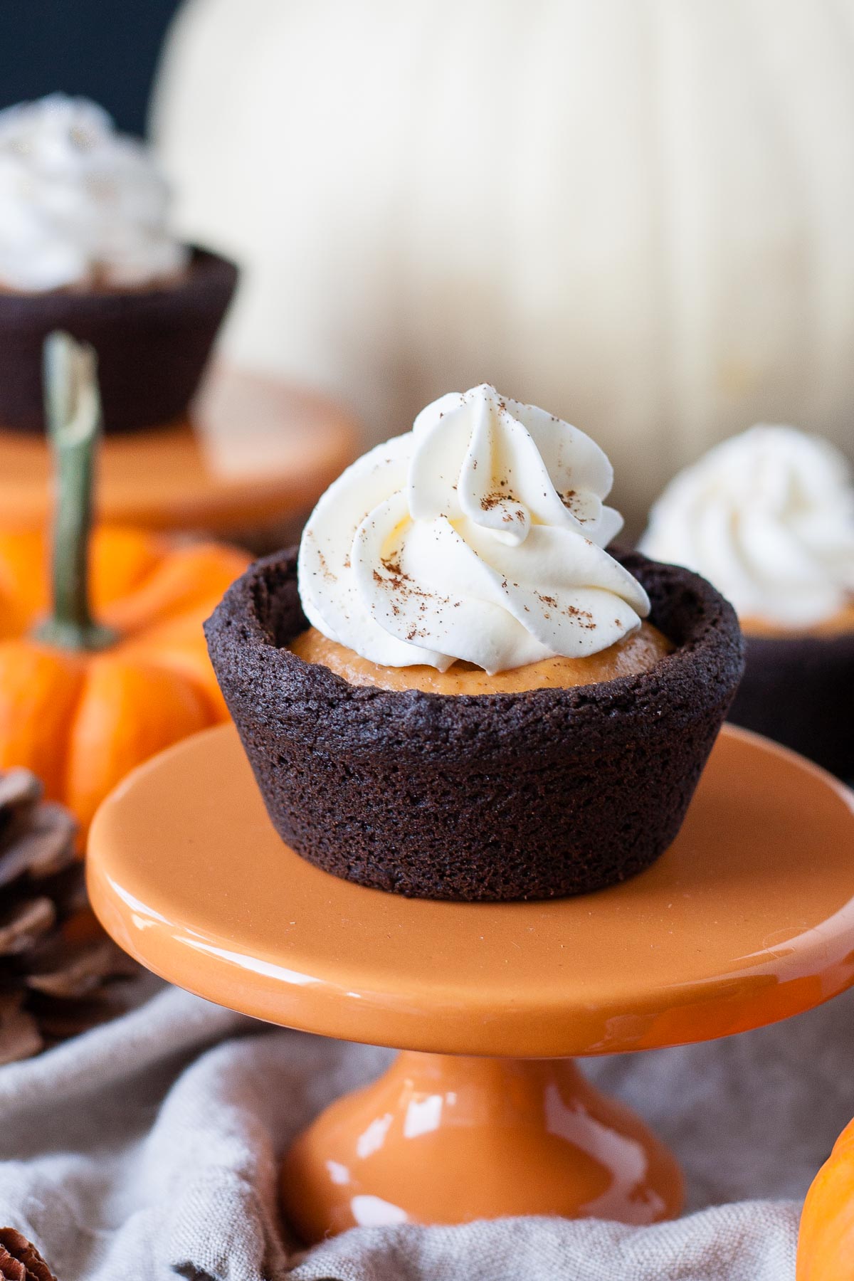 Cookie cup on a small orange cupcake stand.