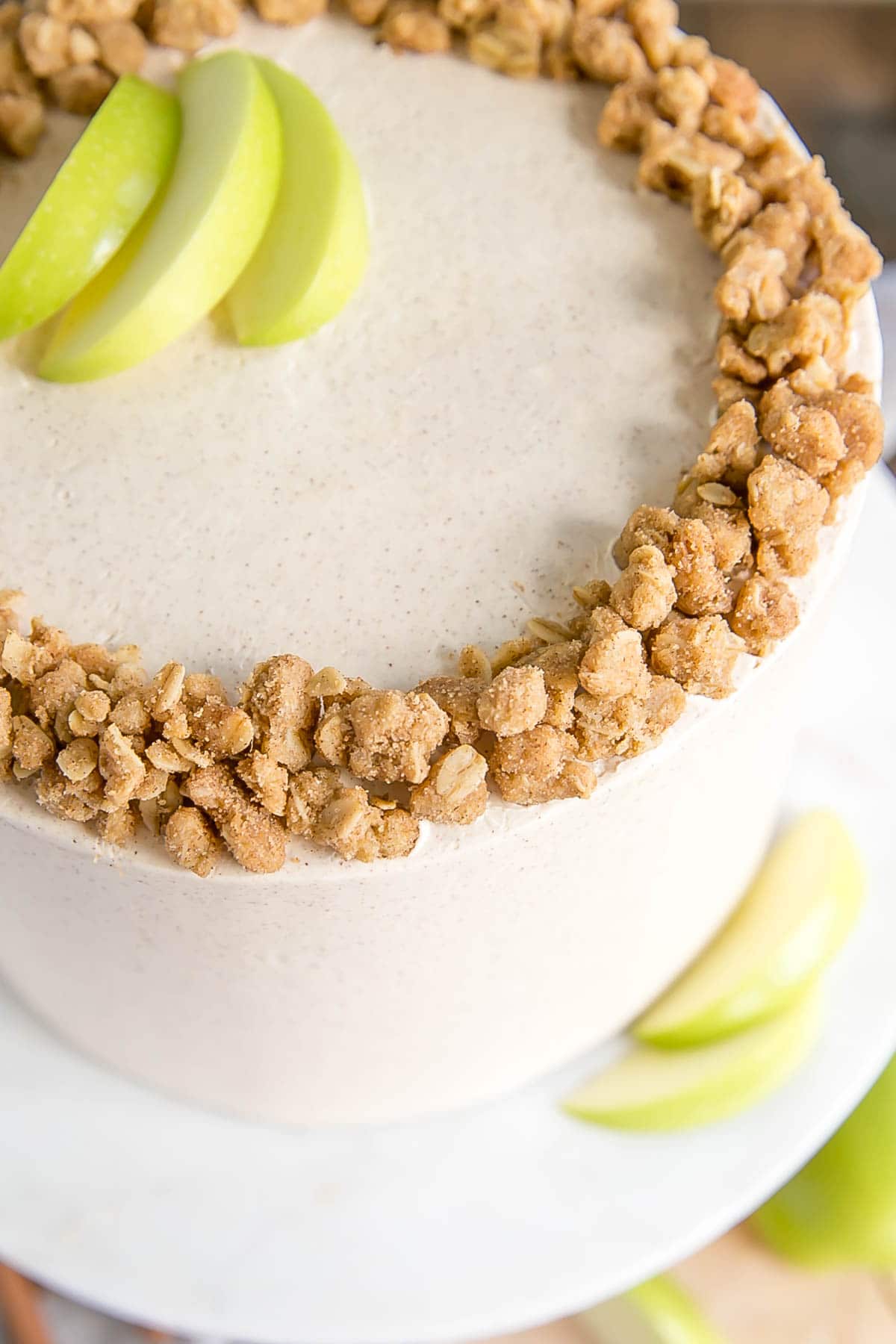 Close up of apple crumble on the top of the cake.