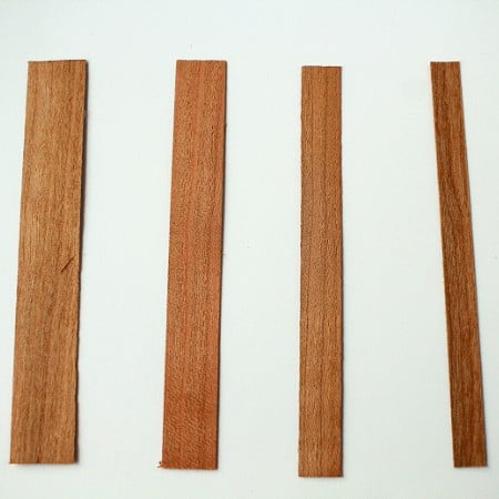 four single ply wood wicks laid side by side of varying widths