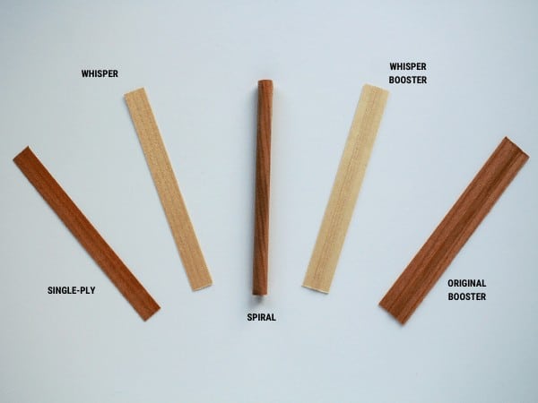 5 different wood wicks laying on a flat surface: single-ply, whisper, spiral, whisper booster, and original booster