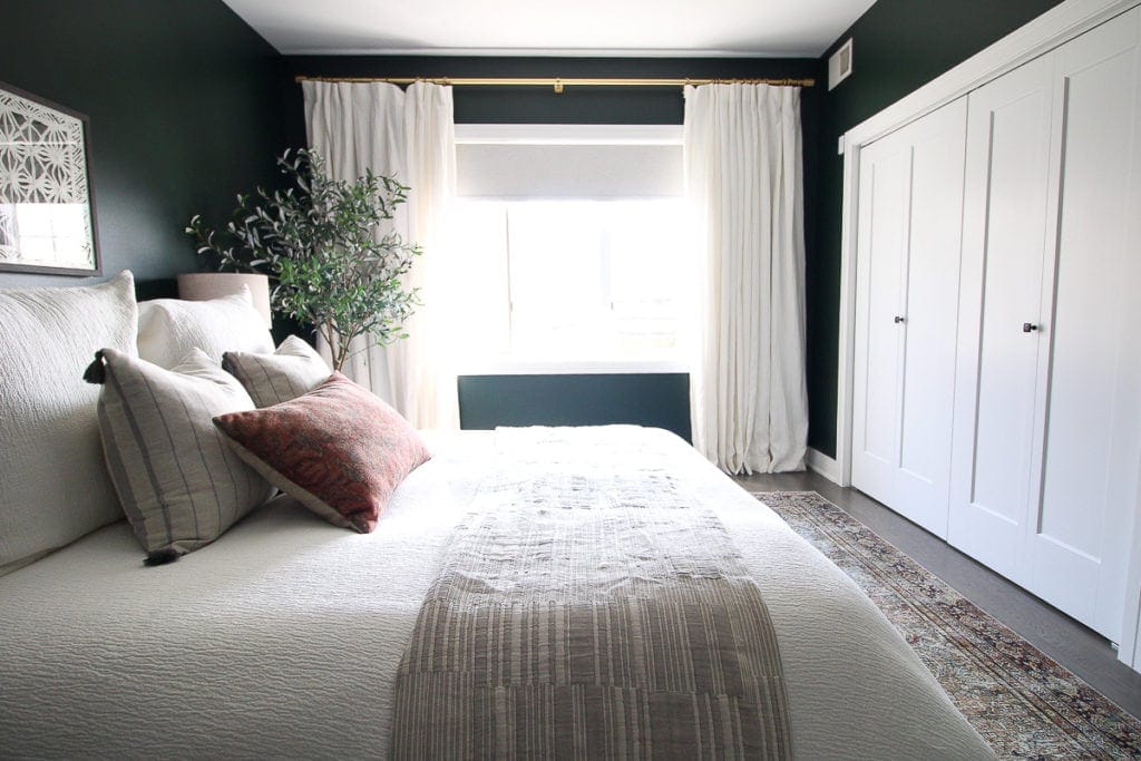 Dark green guest room reveal with white curtains