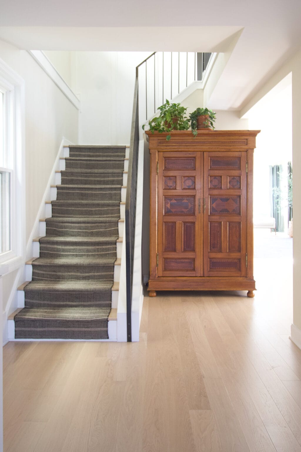 Adding a striped stair runner to our stairwell