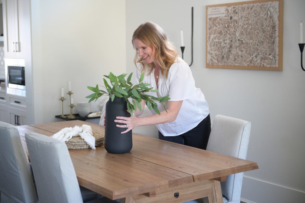 Kerri placing plants on the table 