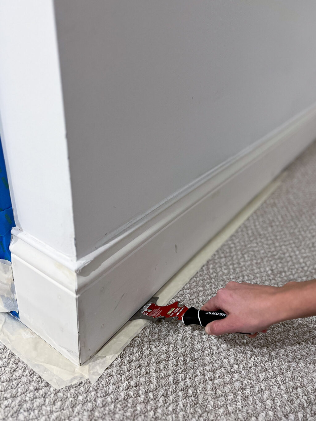 Use masking tape under your baseboards