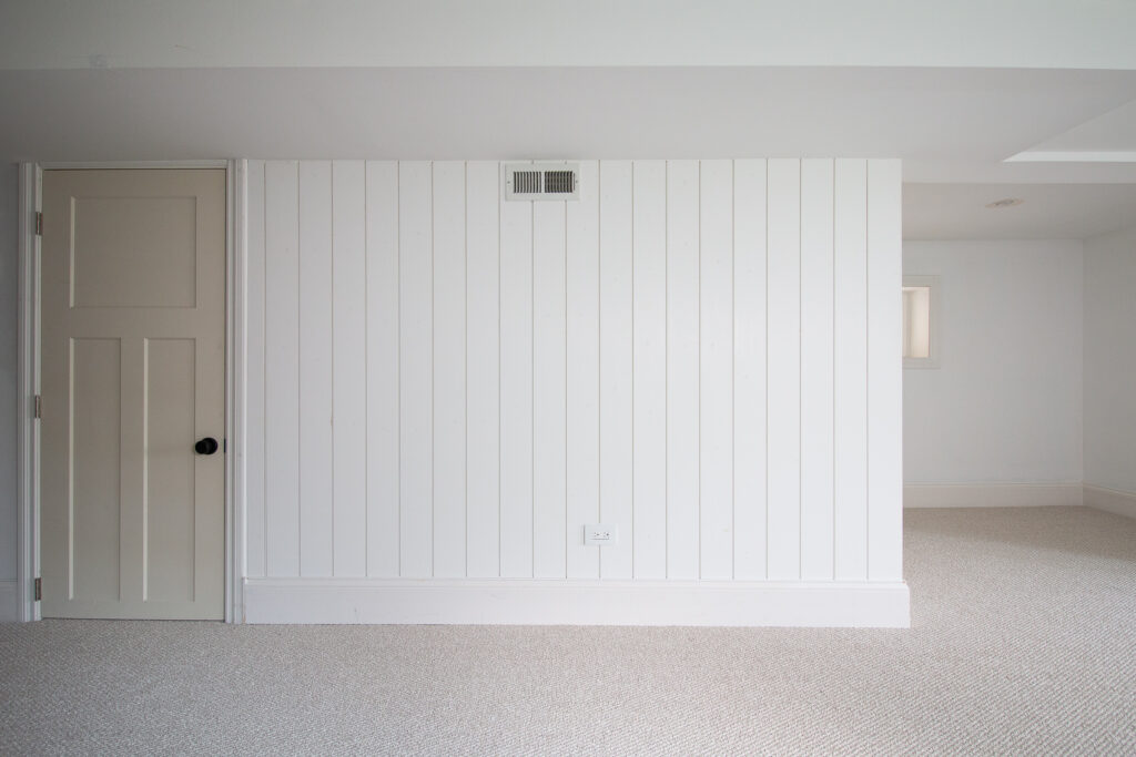 Adding vertical shiplap to the basement