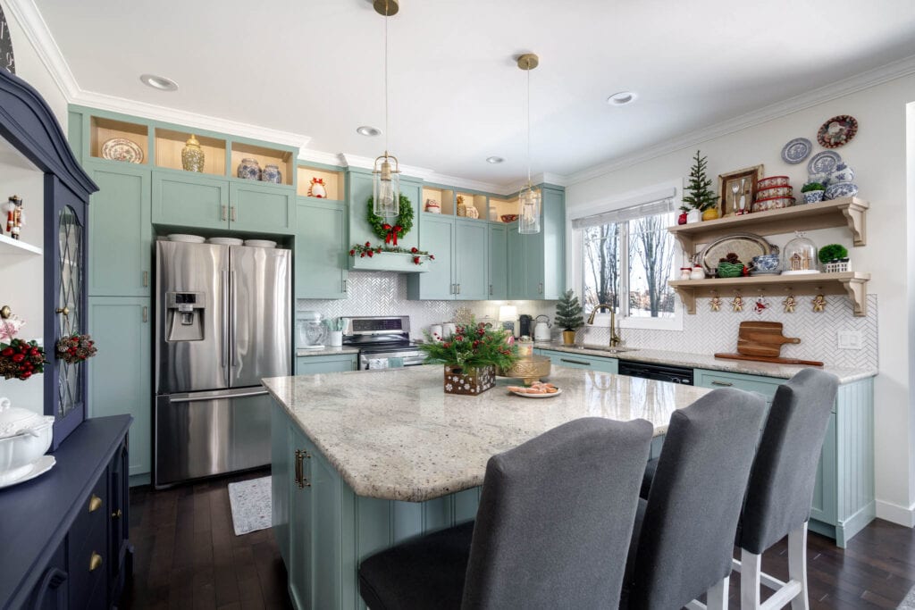 A blue kitchen with gold accents 