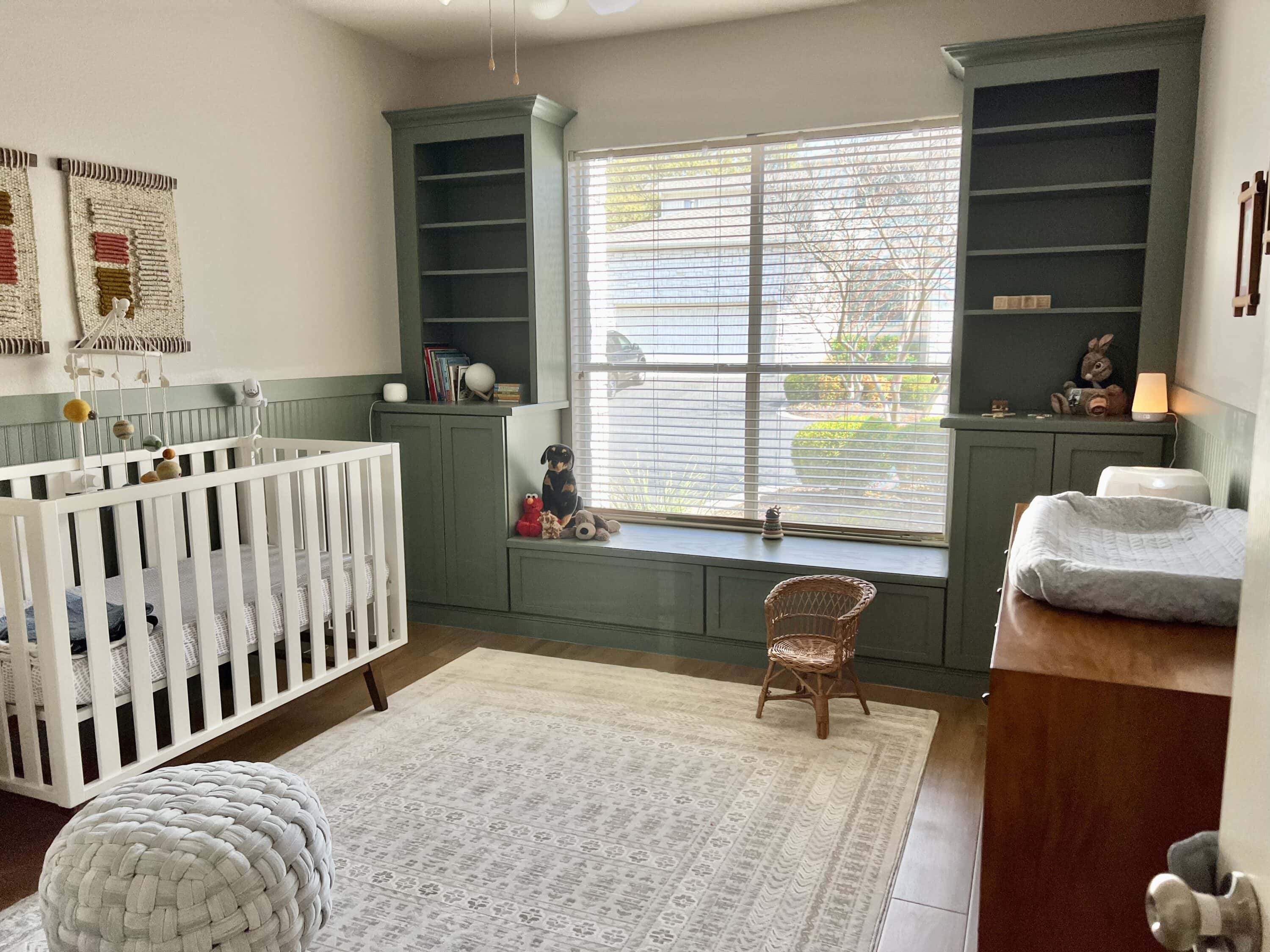 Sage green built-ins in a nursery