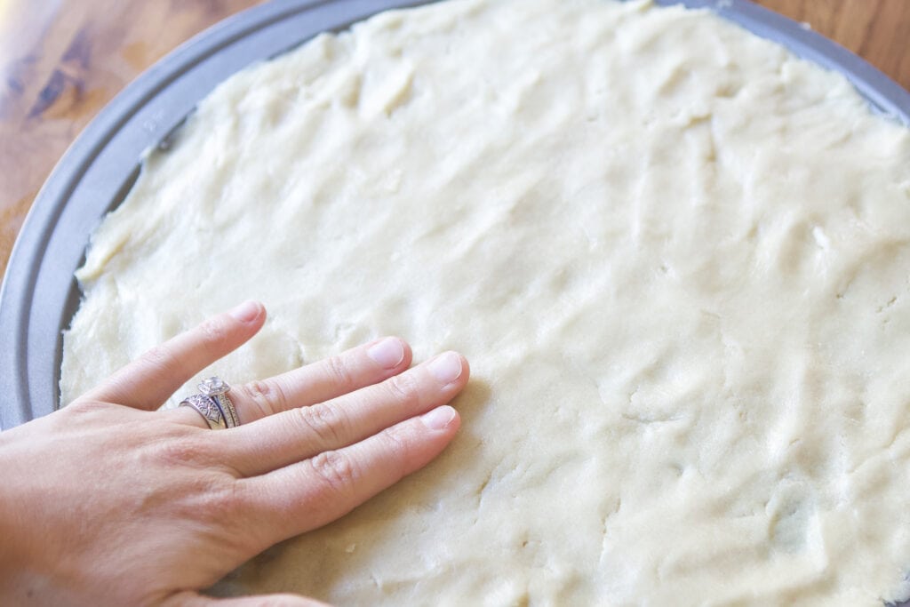 Press the cookie dough into the pan