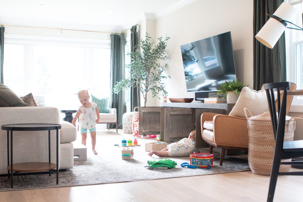 Rory cleaning up the living room