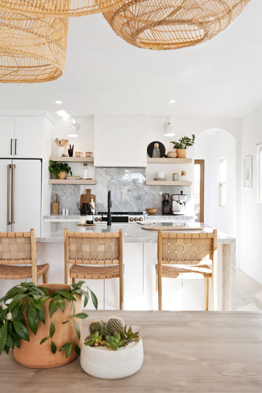 Open concept kitchen with wood shelves