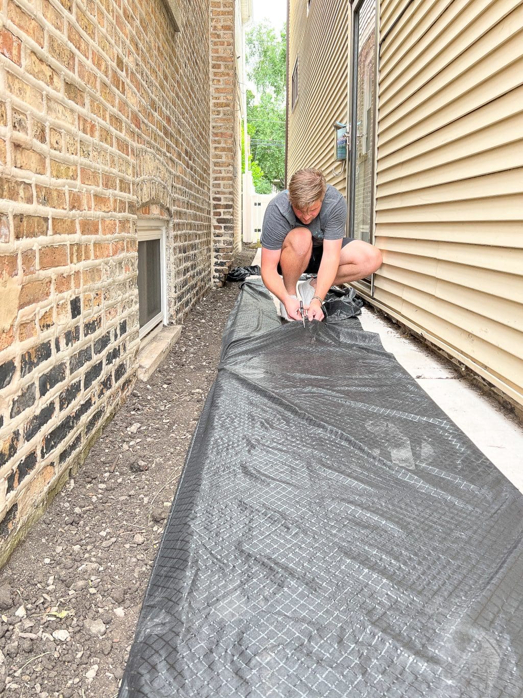 Cutting our landscape fabric