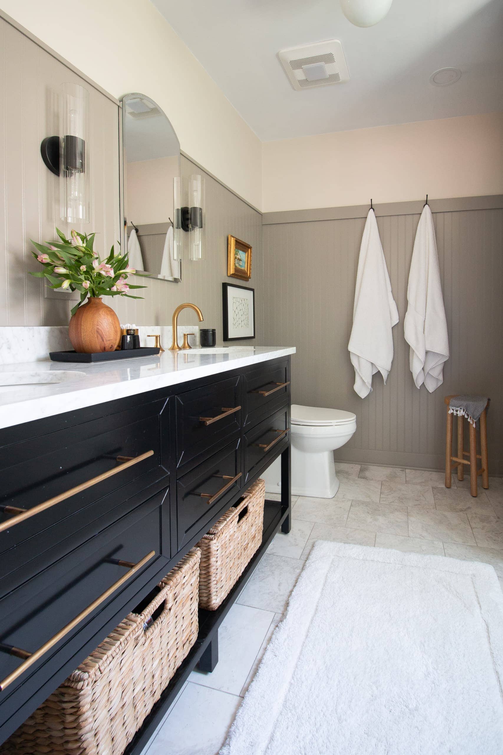 Black vanity with a marble top