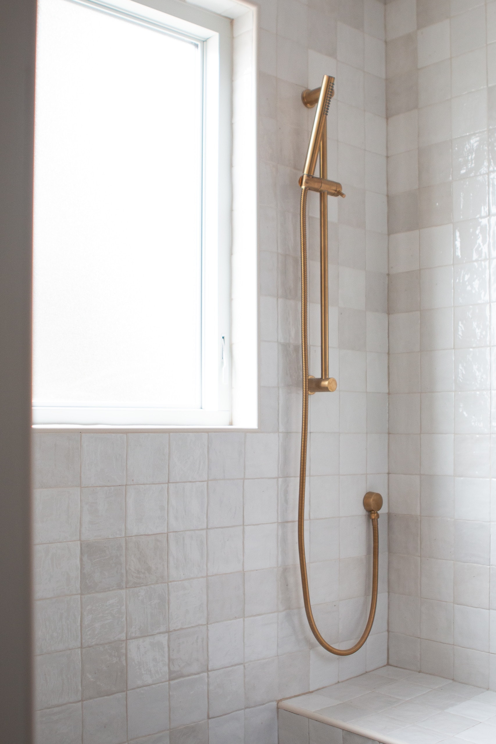 handheld shower sprayer in gold