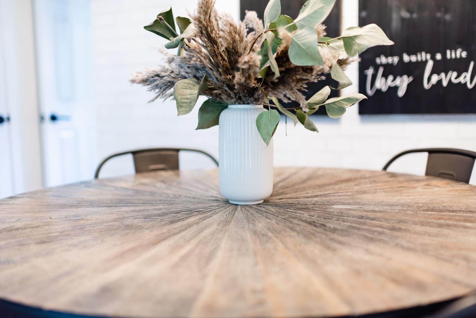 floral arrangement on a farmhouse dining table
