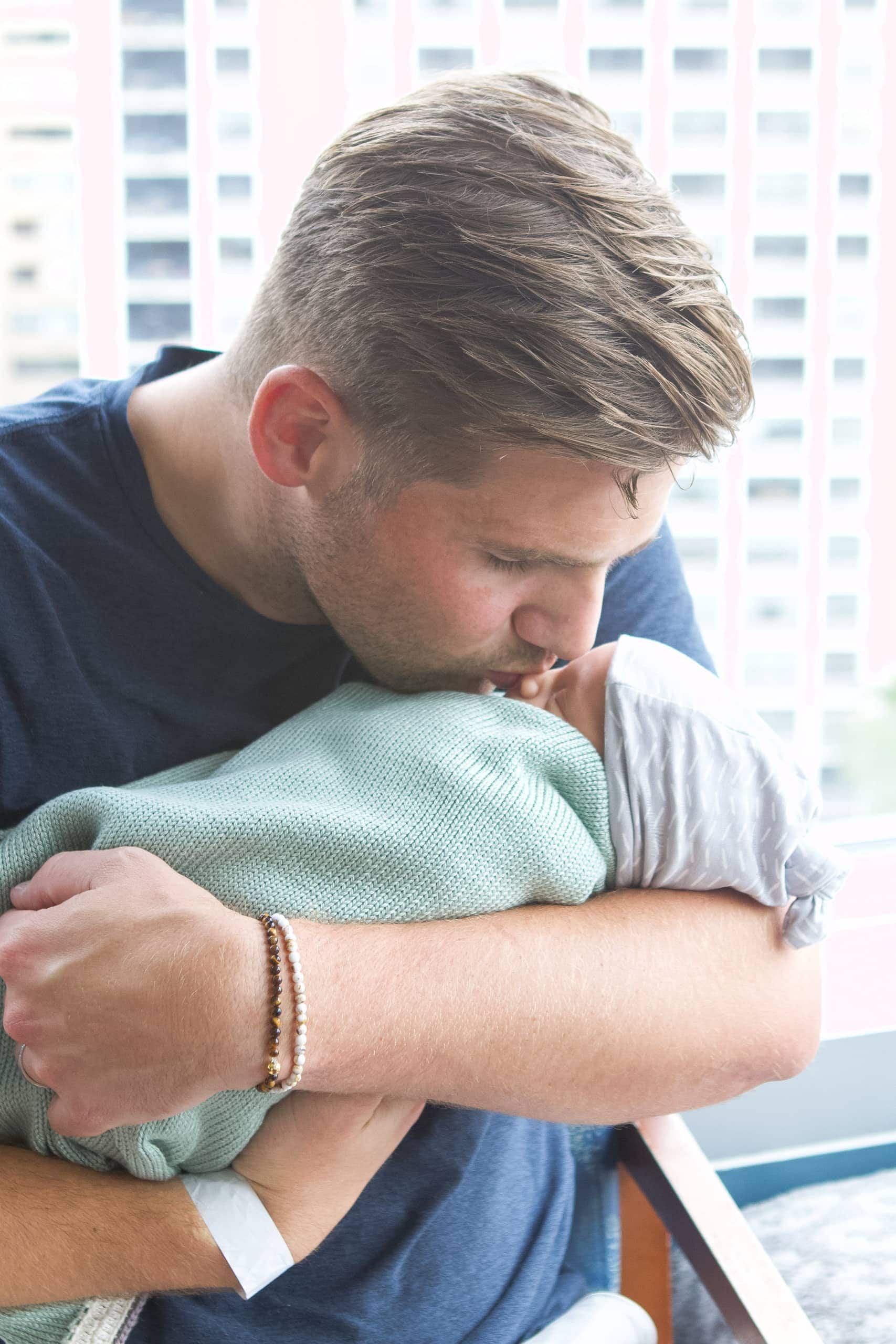 Finn snuggling our baby boy