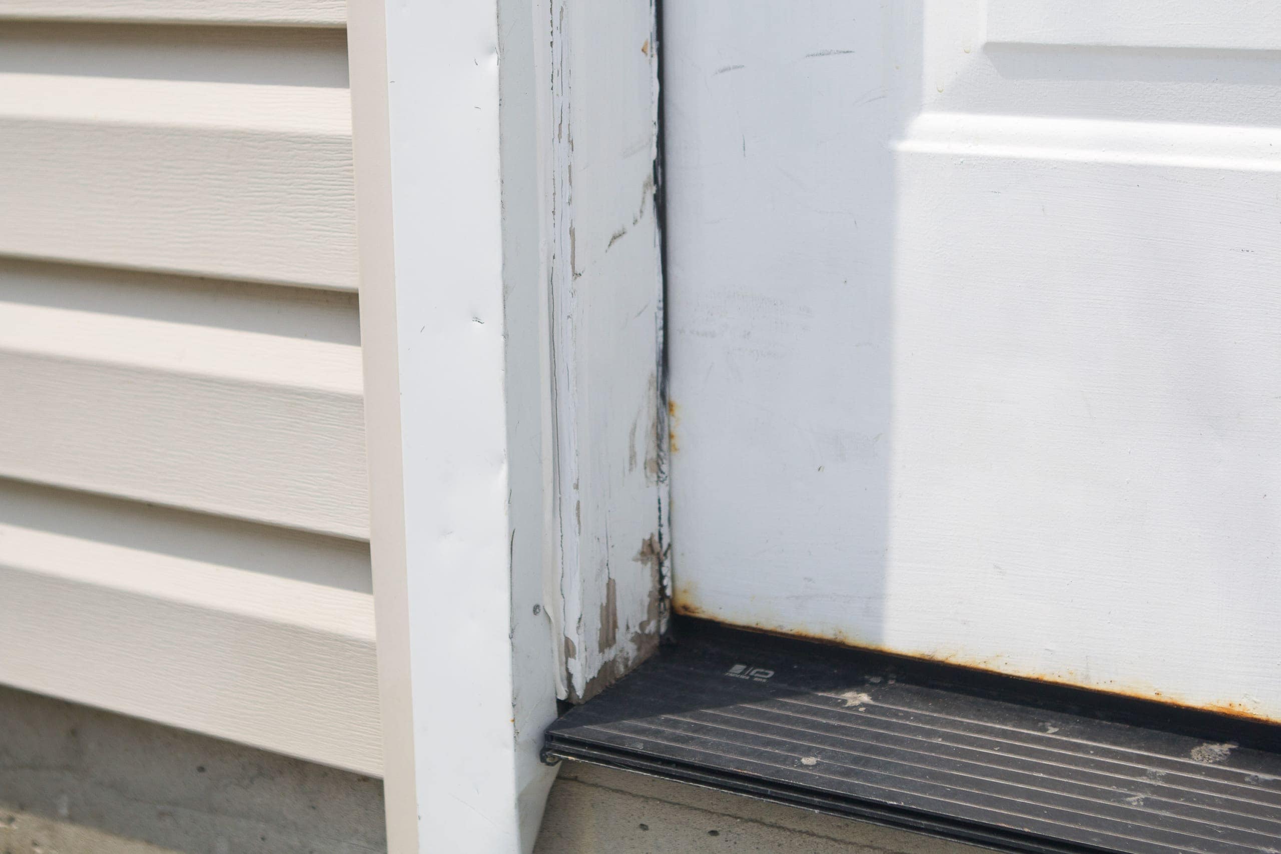 Painting the white trim around our garage door