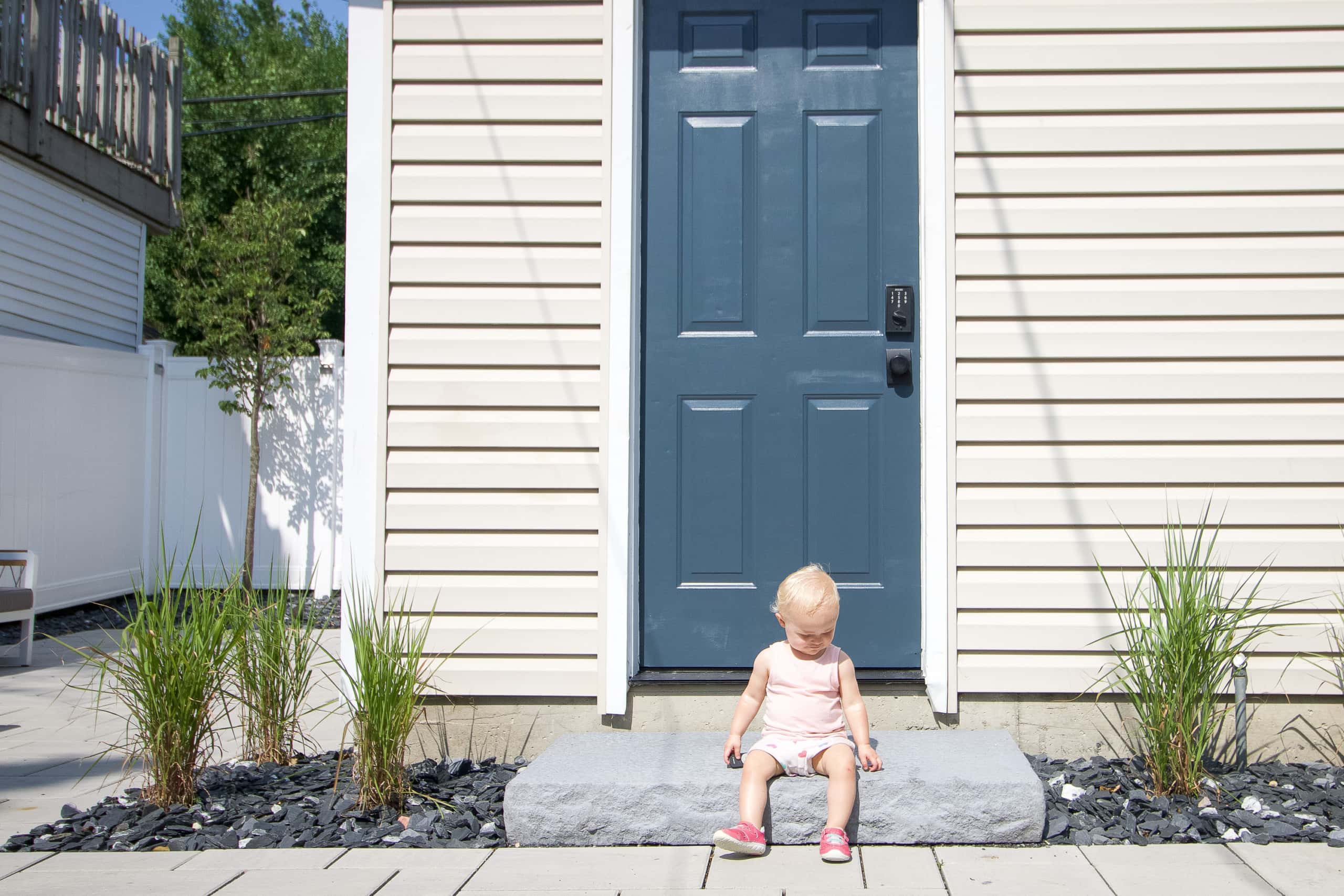 Rory in front of our new blue door