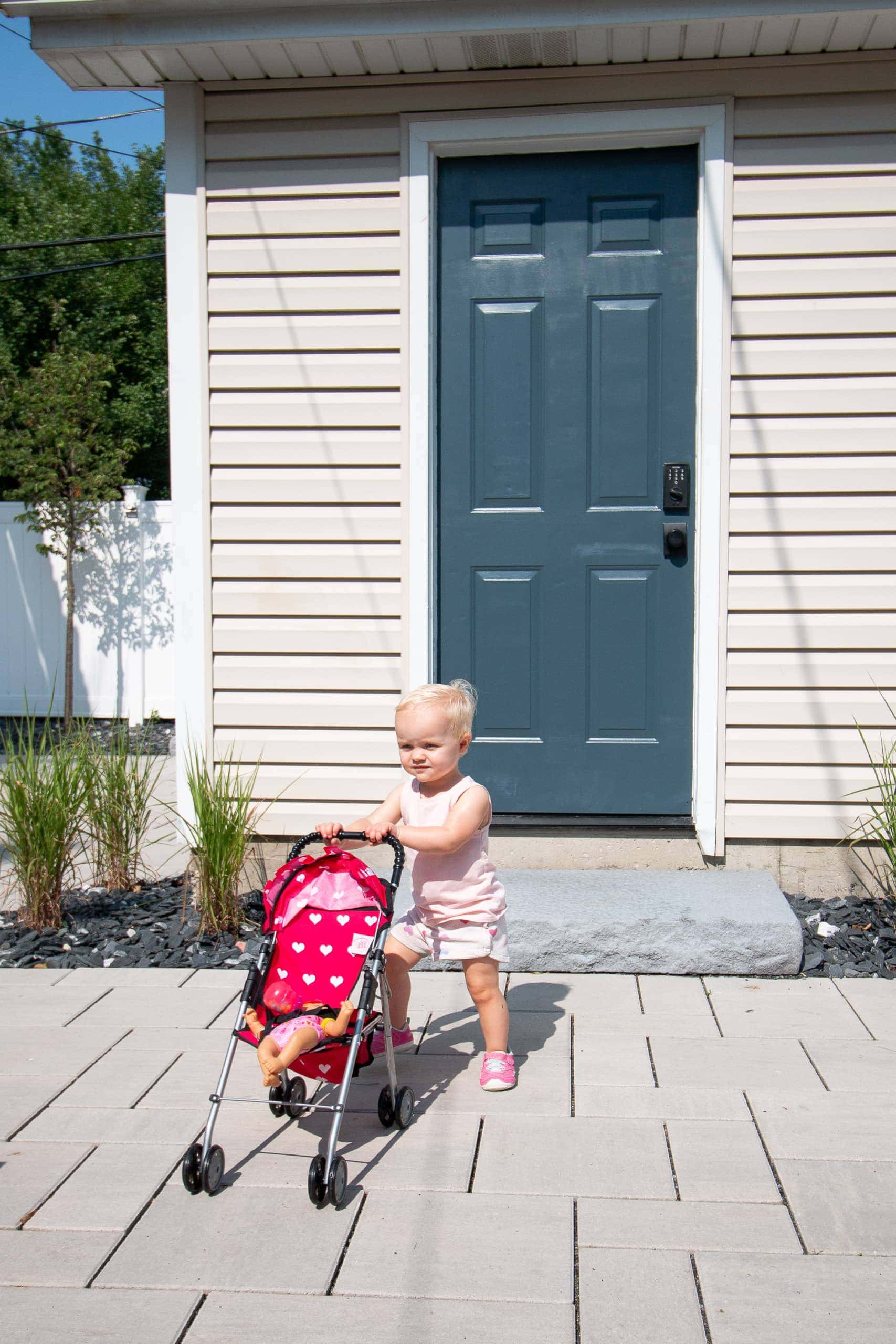 Rory posing in front of our metal door to the garage