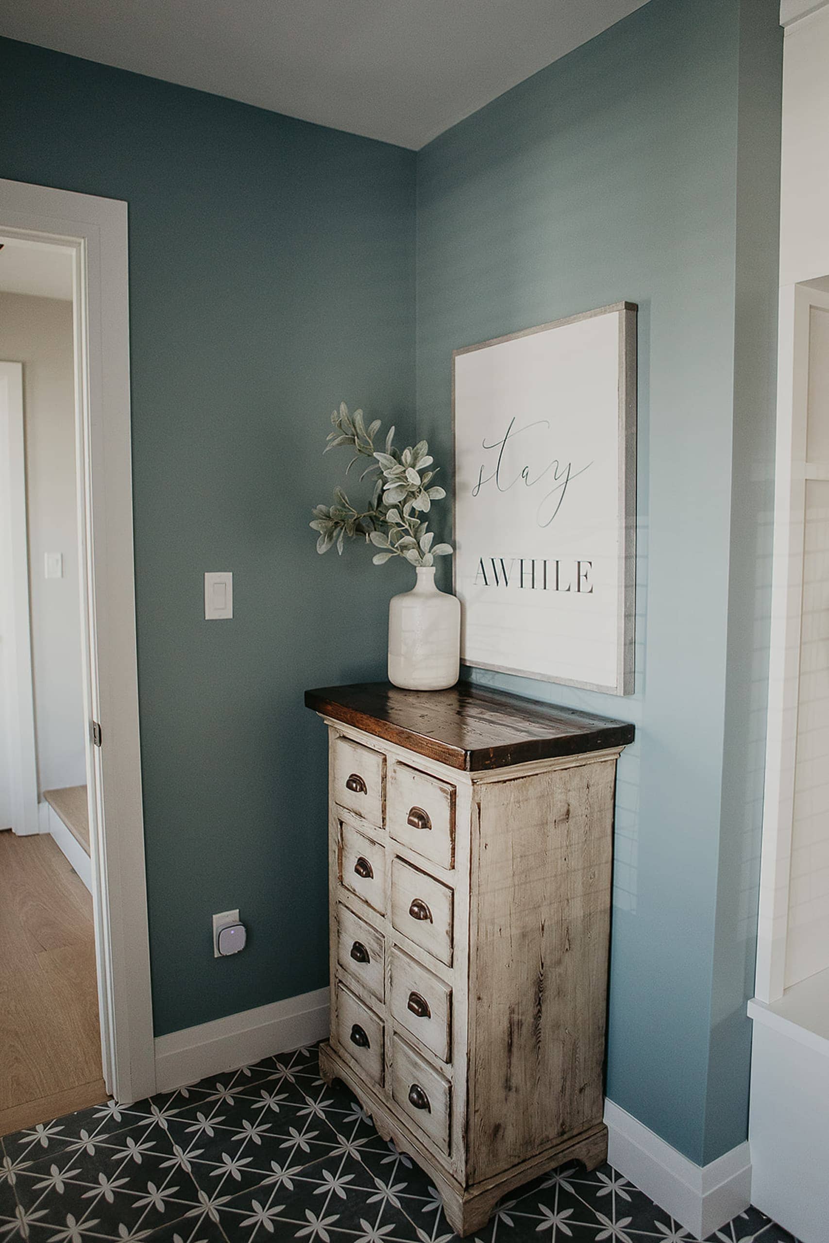 Blue walls in this entryway mudroom