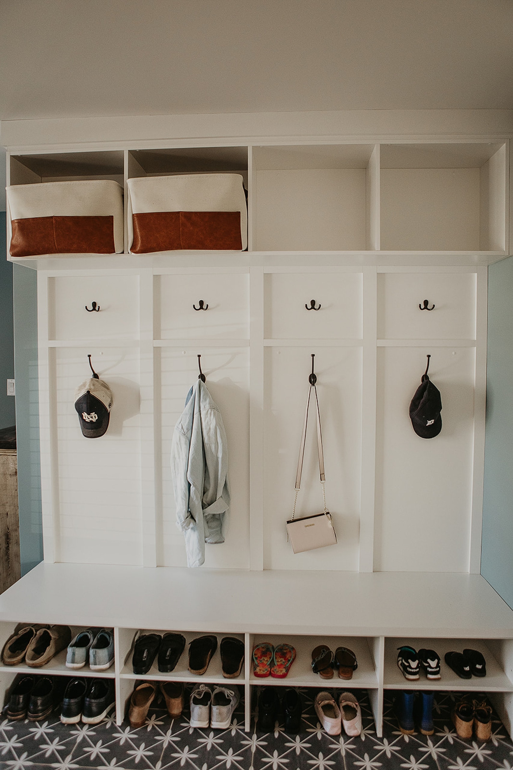 Mudroom with hooks and storage cubbies