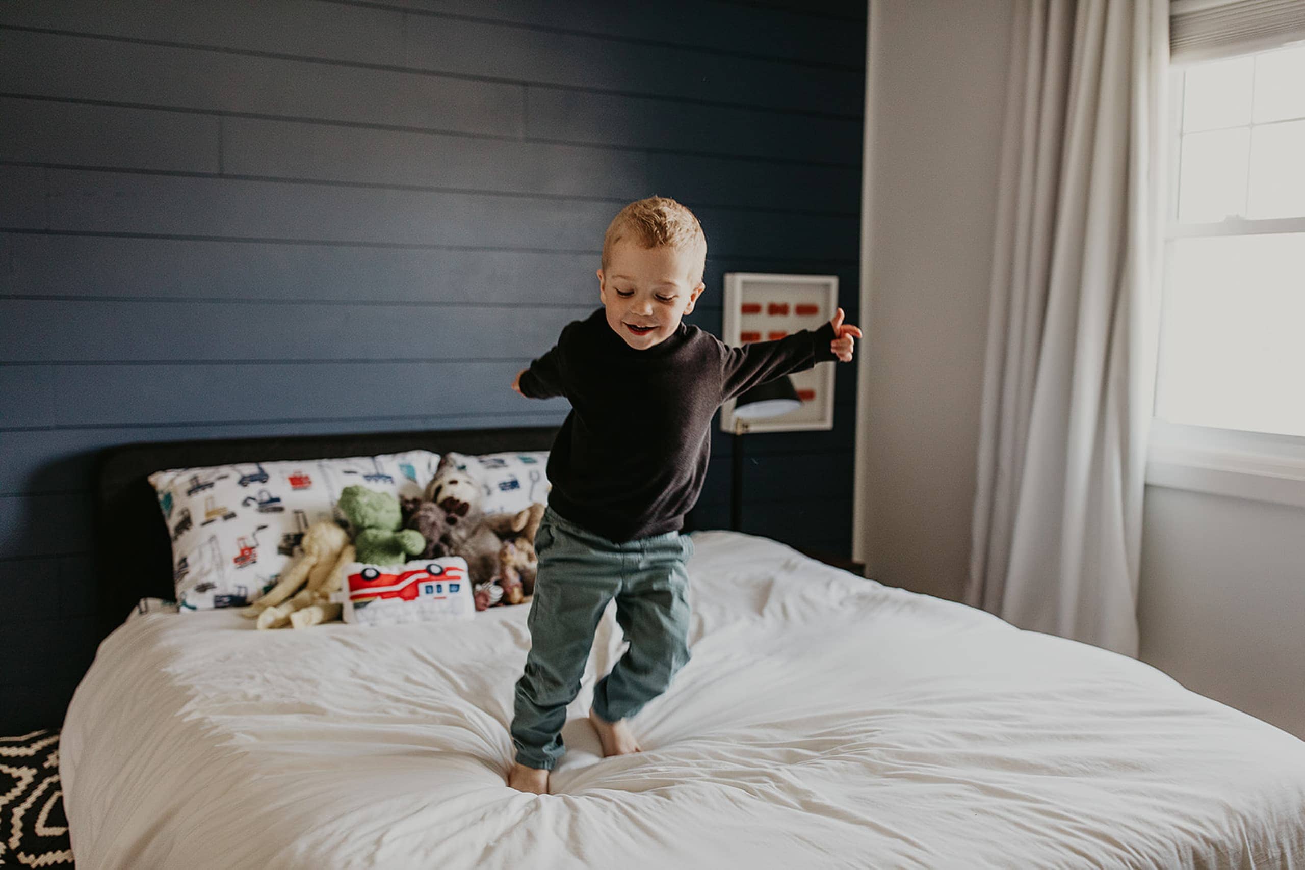 Cooper jumping on the bed