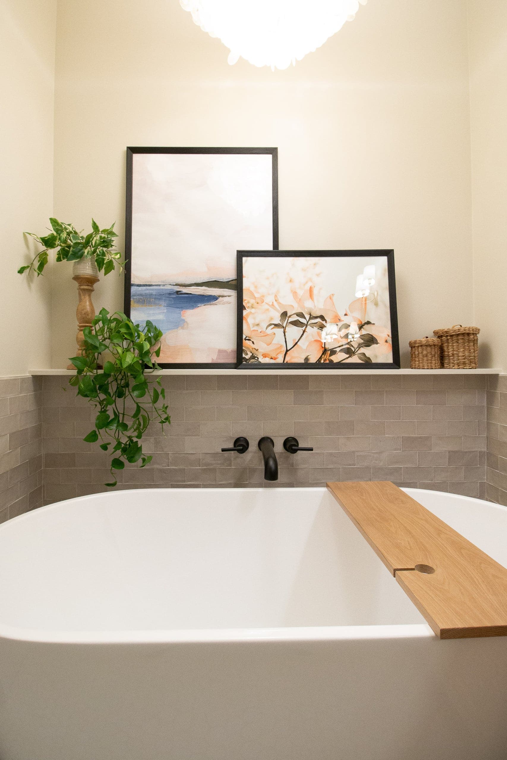 Adding a ledge of art near the freestanding bathtub