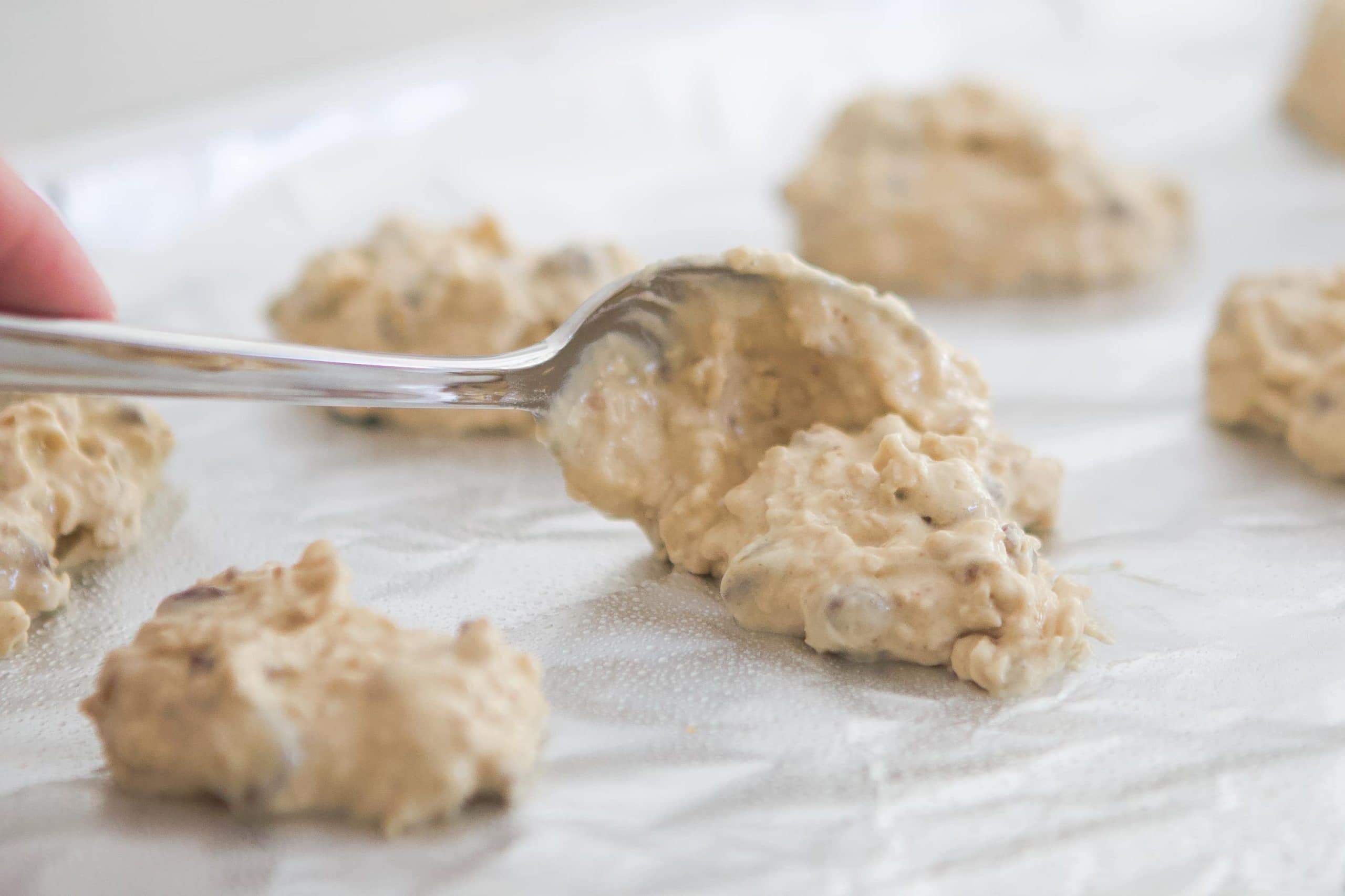 Add spoonfuls of dough to the sheet