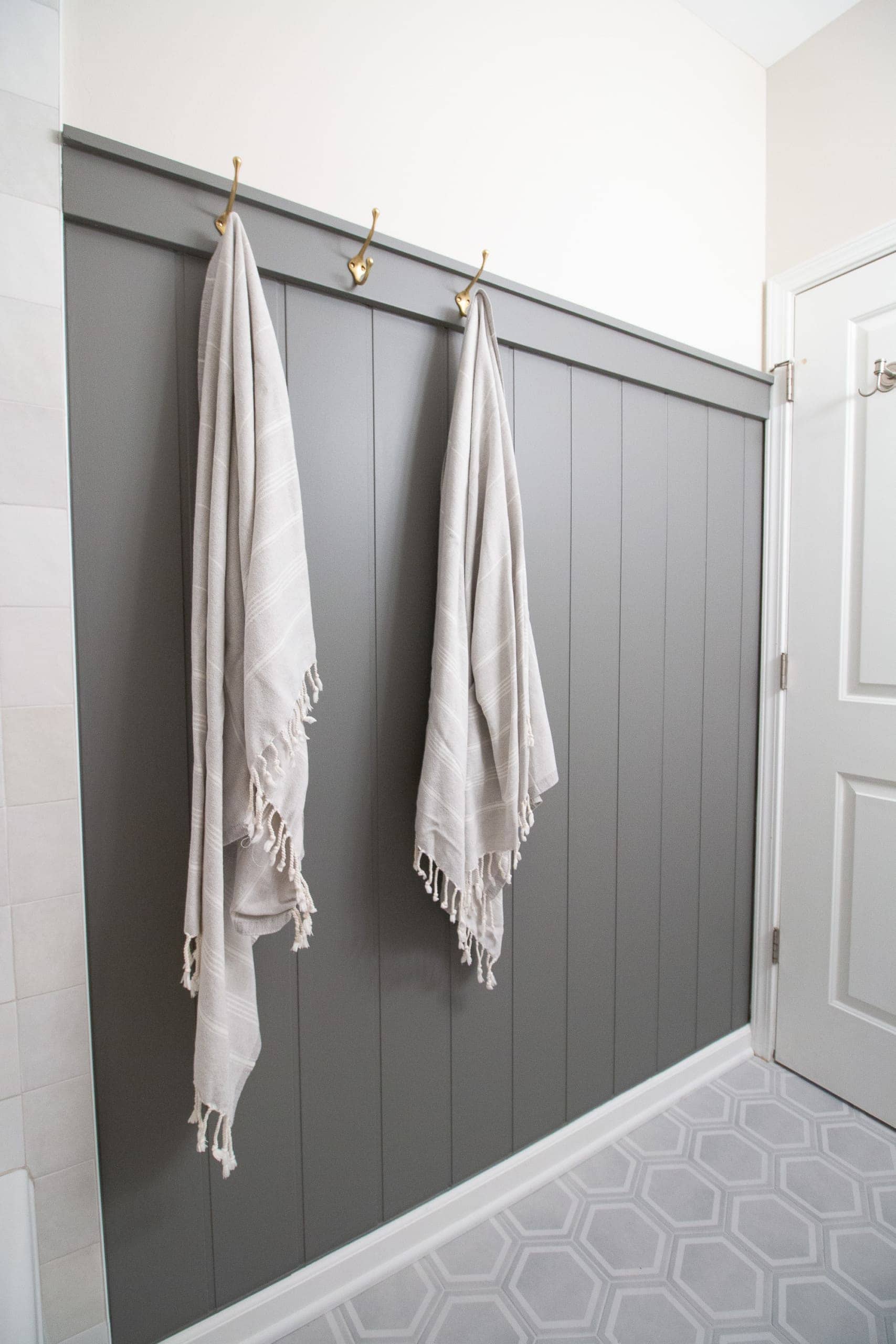 Adding beadboard wall treatment to a small gray and gold bathroom