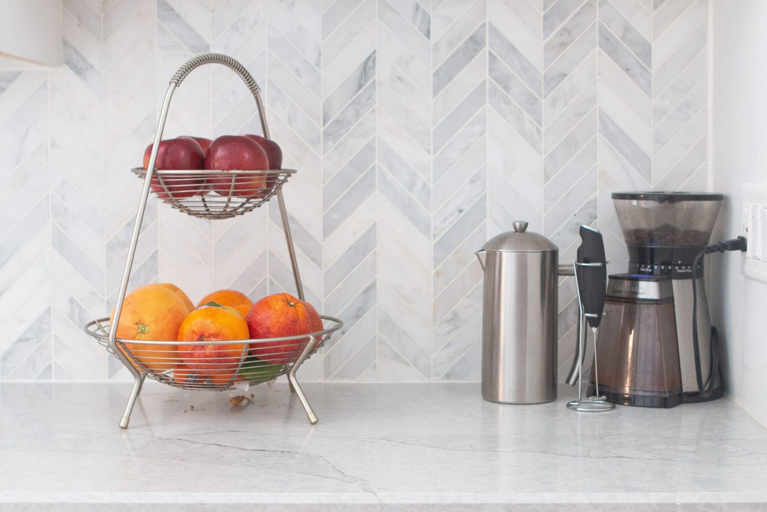 Marble herringbone backsplash