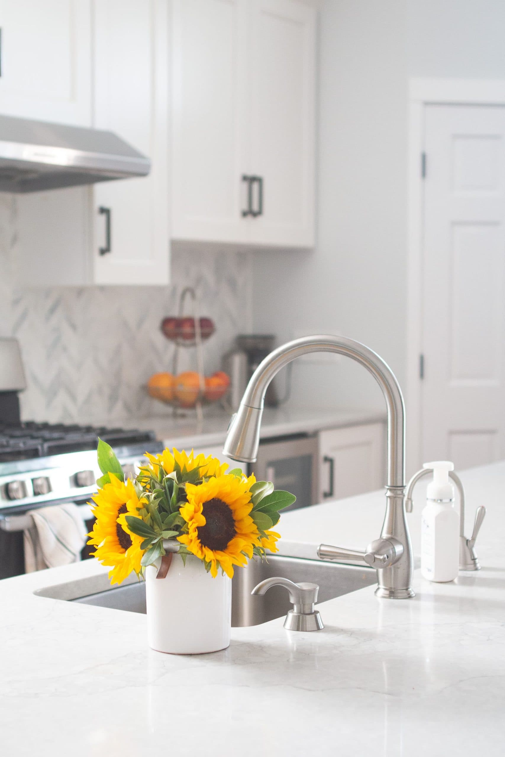 White kitchen with marble backsplash