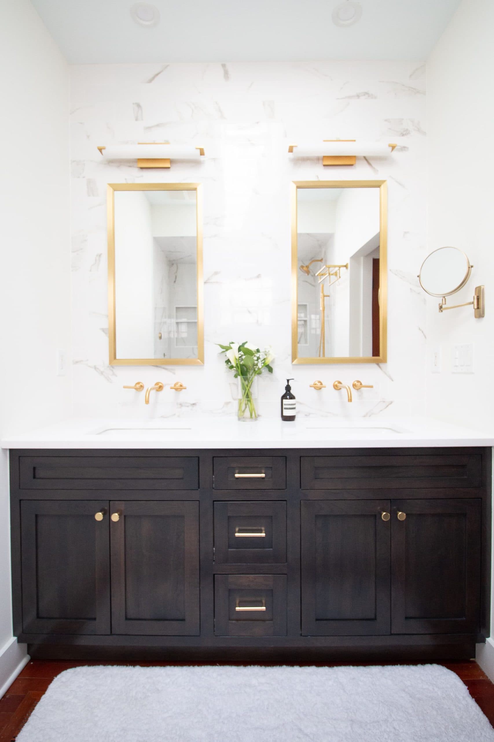 Black and white bathroom with brass accents