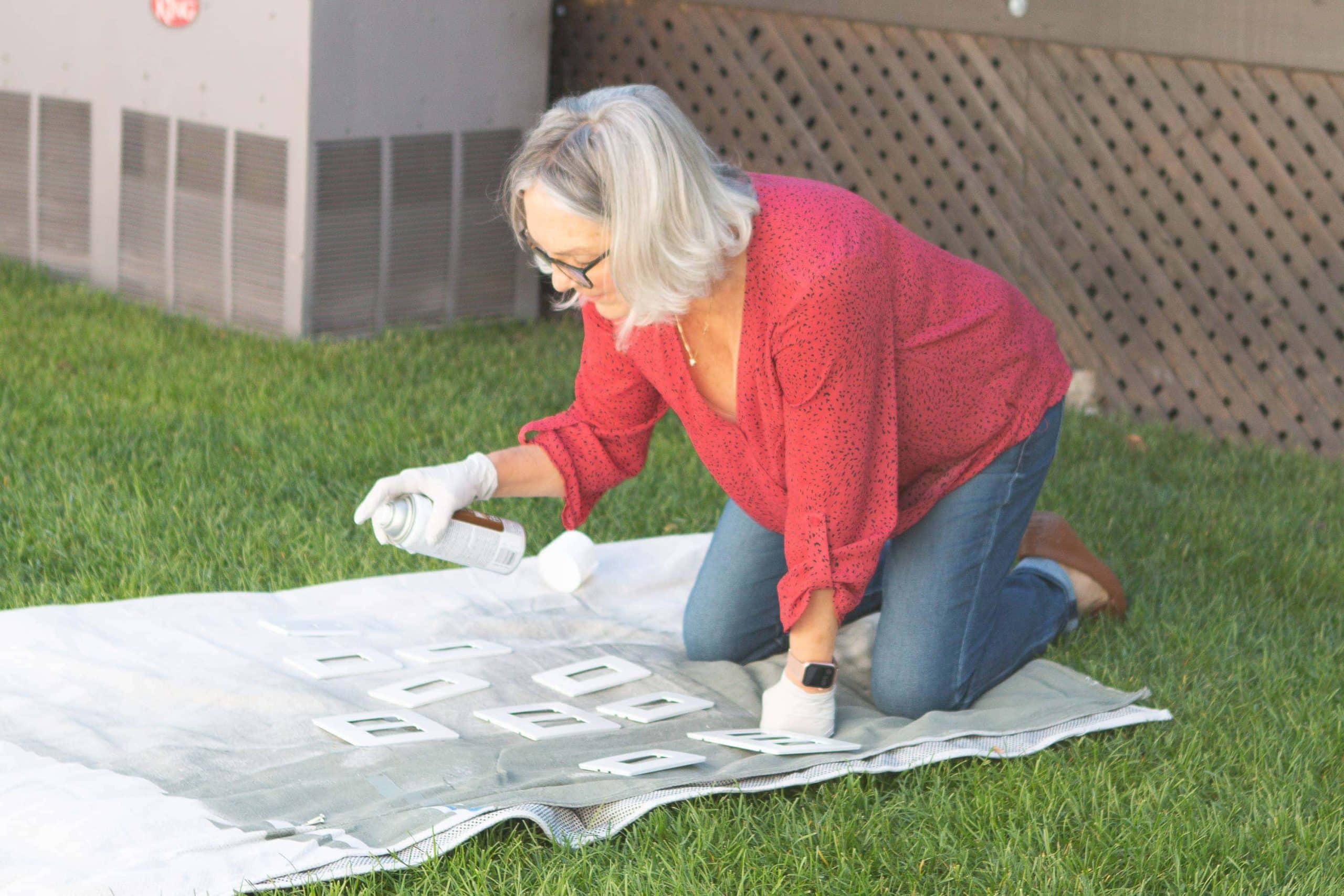 Jan spray painting our outlet covers