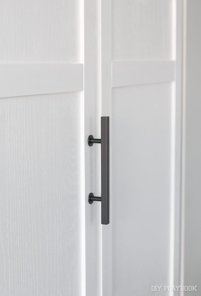 Black handles on the closet doors