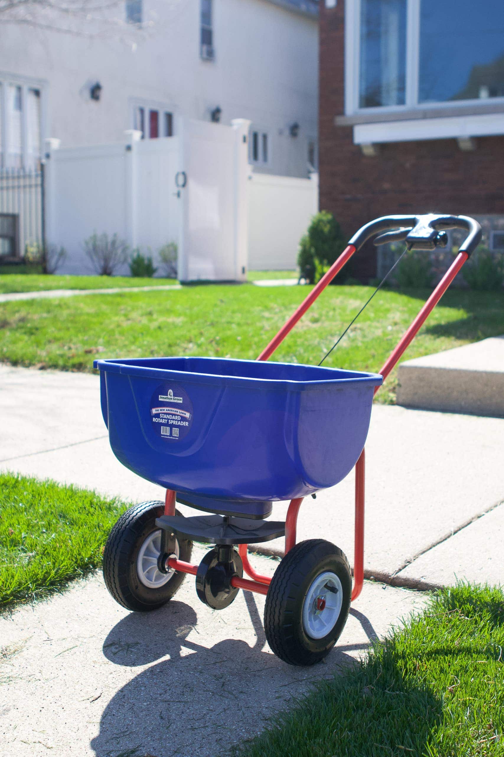 Using a spreader to prep your lawn for spring