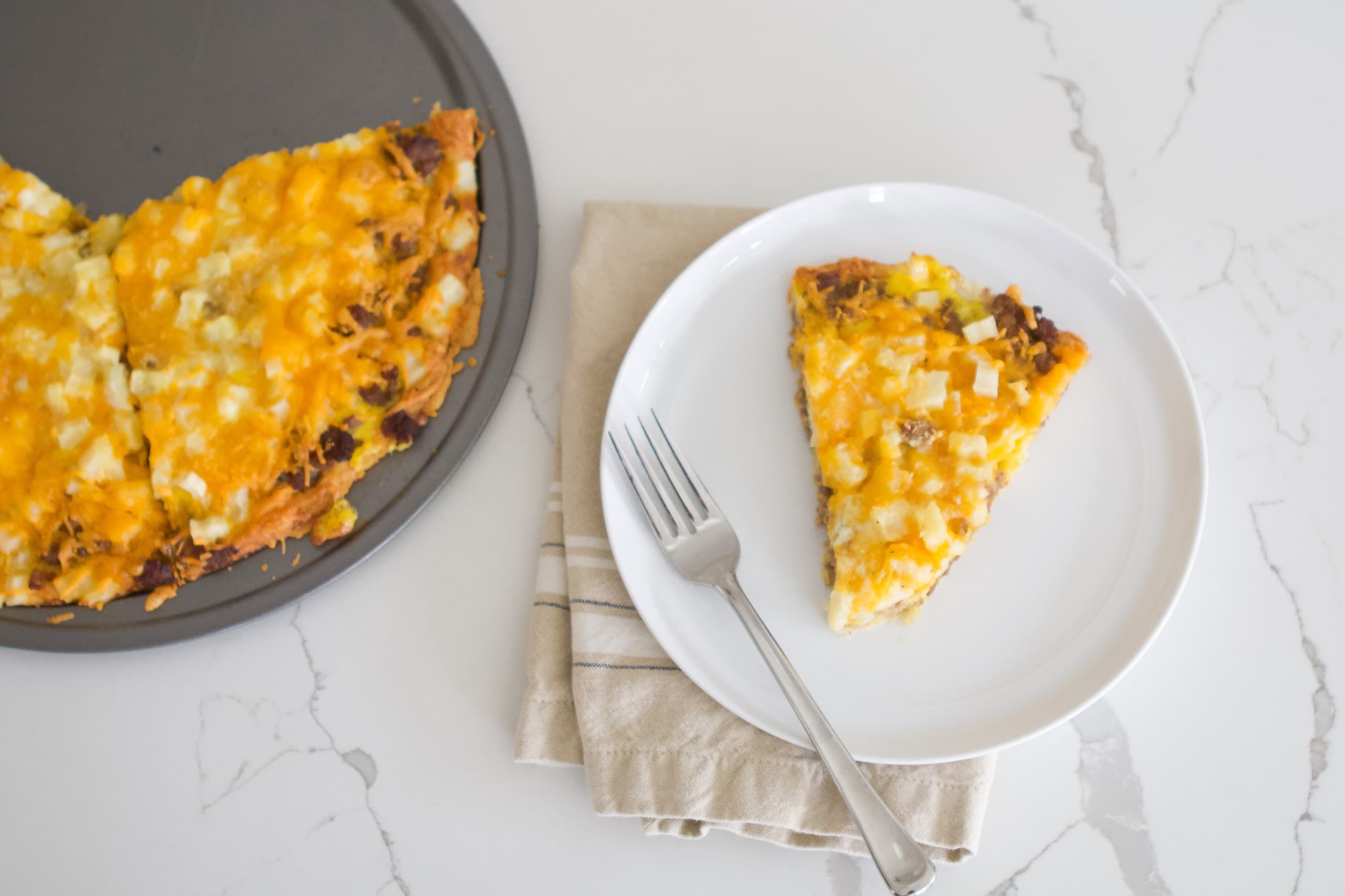 Our family favorite cheesy breakfast pizza recipe