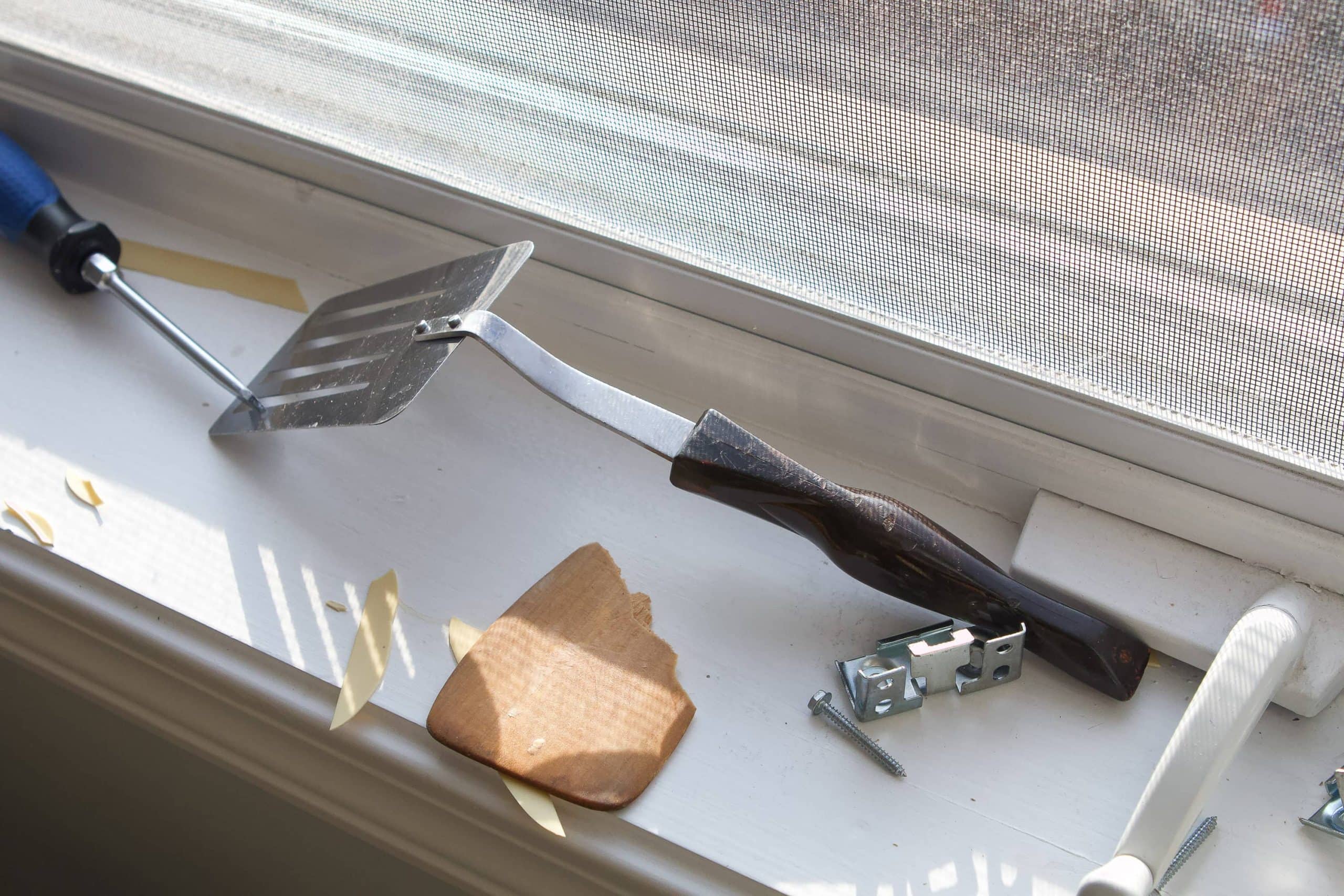 Spatula to remove old window treatments