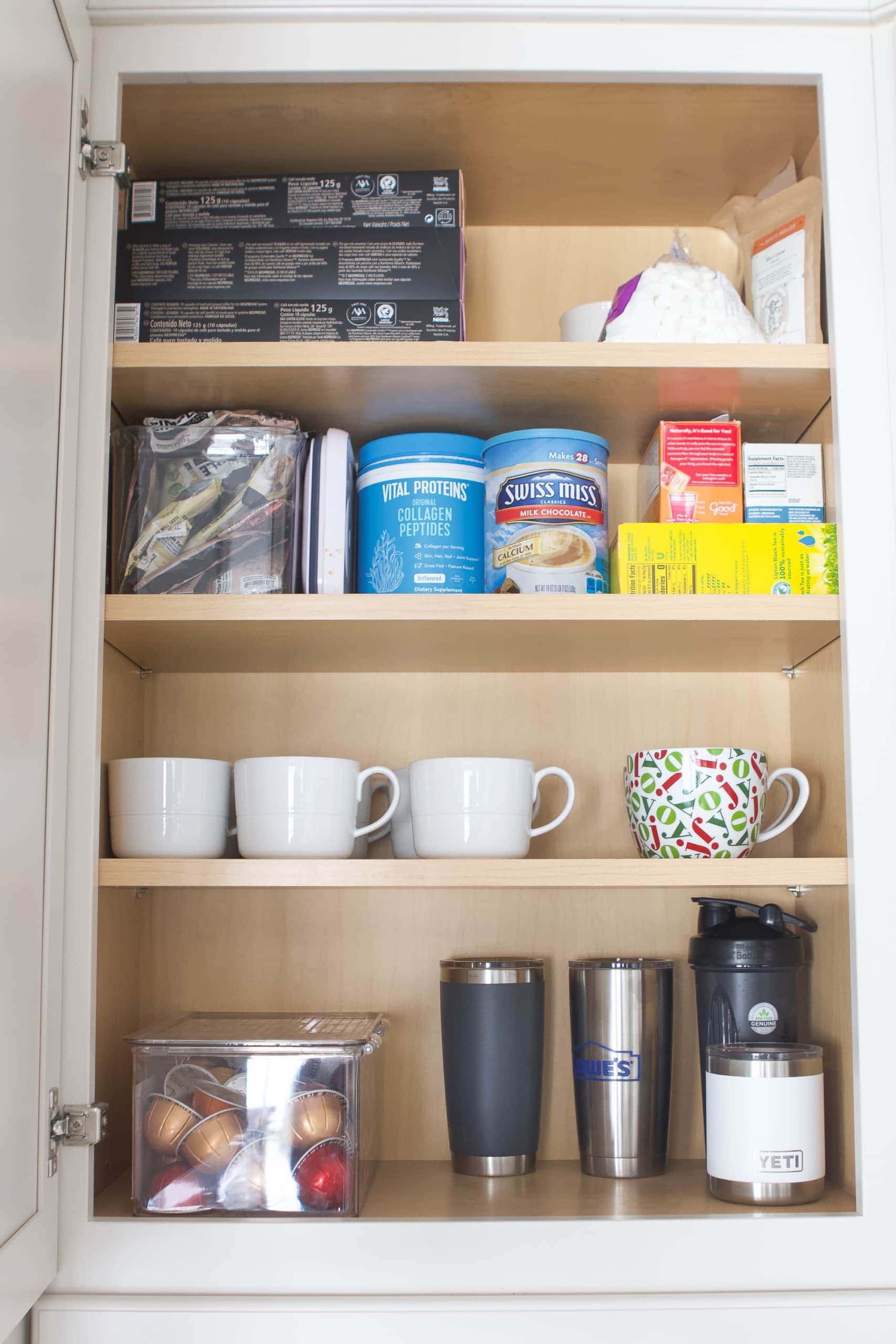 Putting coffee cups above the coffee maker