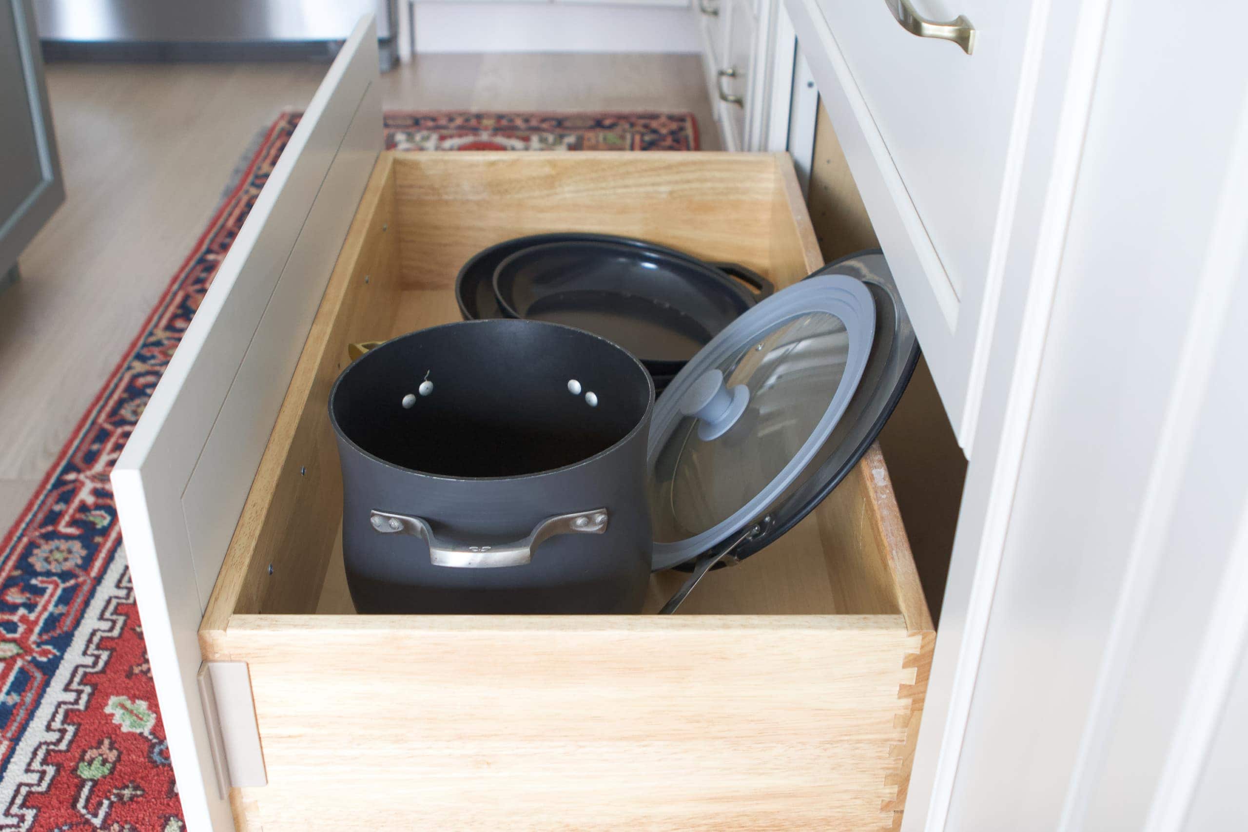 Pots and pans underneath the stove